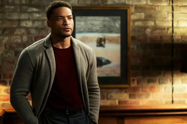 Kam stood looking at Sasha