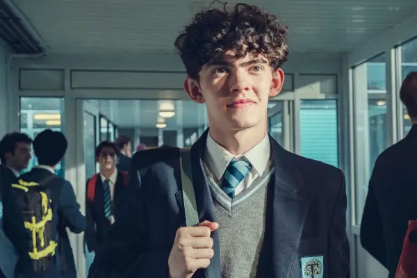 Charlie walking through the school corridor