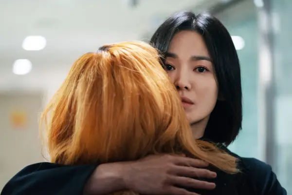 Moon hugging a woman with ginger hair