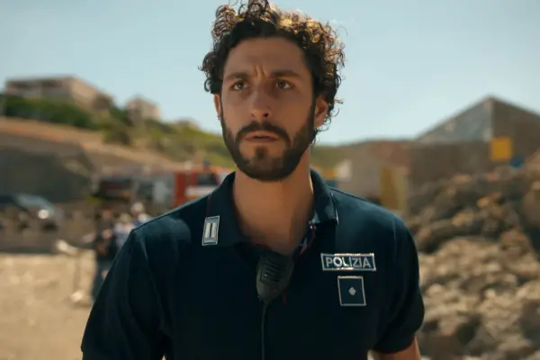 Lorenzo de Moor in The Iris Affair, wearing a police uniform and looking concerned.