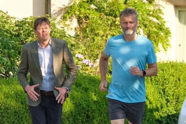 Kris Marshall and Hugh Dennis in Beyond Paradise stood next to each other.