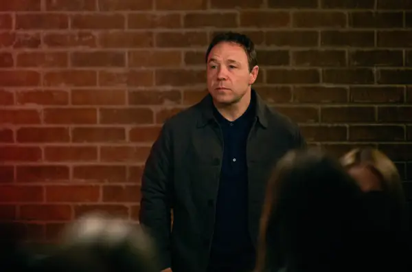 Stephen Graham as Andy Jones in Boiling Point wearing a dark shirt and jacket