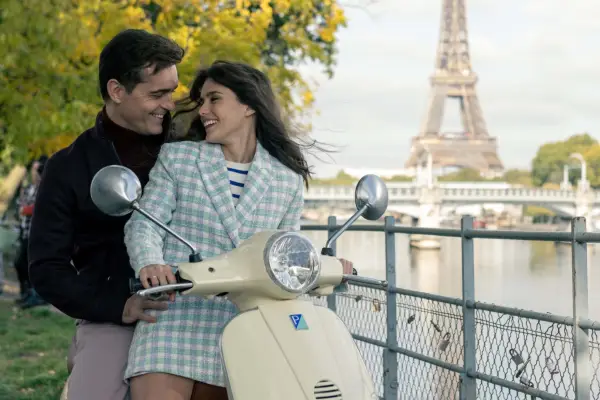 Pedro Alonso and Samantha Siqueiros in a scene from Money Heist: Berlin, with the Eiffel Tower in the background