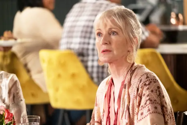 Caroline Lagerfelt as Paula, looking surprised