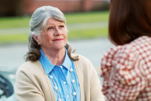 Judith Ivey as Bonnie and JoAnna Garcia Swisher as Maddie talking to one another in the street