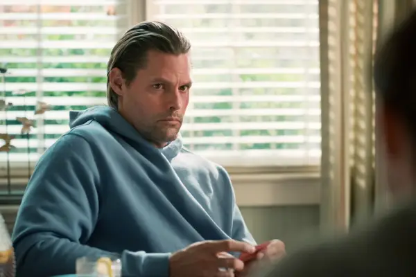 Justin Bruening as Cal, down on a chair