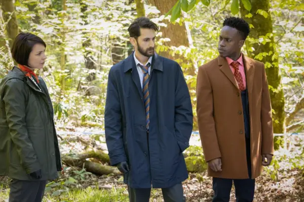 Hannah Donaldson, Bhav Joshi and Romario Simpson in Granite Harbour standing in the woods