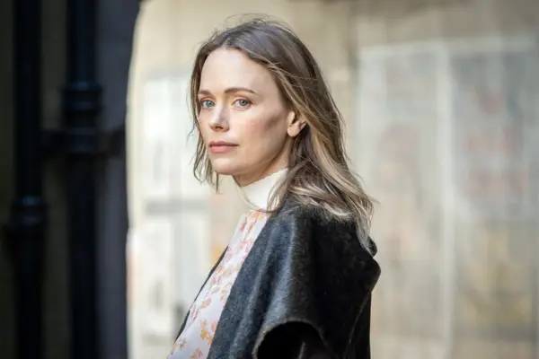 Katia Winter stars in Granite Harbour in a black jacket and flowery shirt