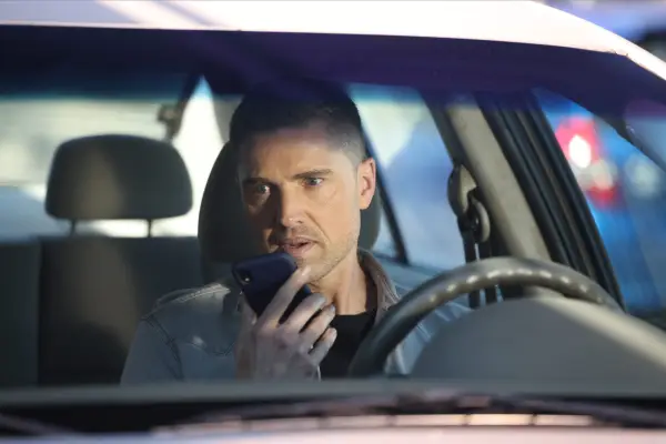 Eric Winter as Tim Bradford in The Rookie sitting in the driver