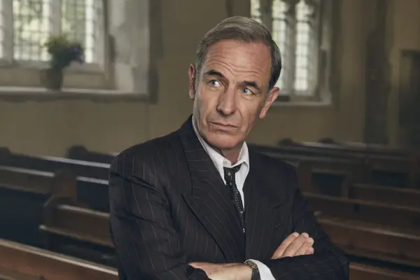 Robson Green in Grantchester season 8 wearing a suit with his arms crossed