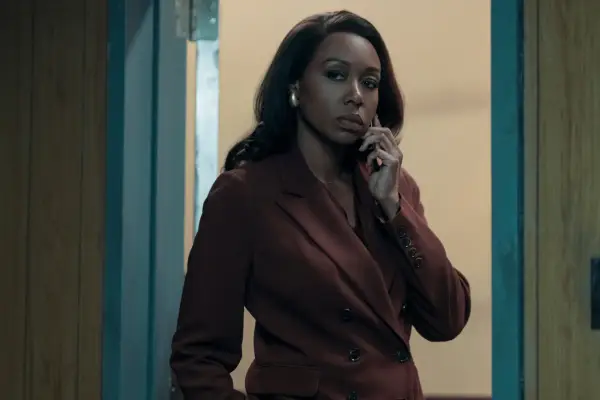 Amanda Warren as Catherine in The Night Agent, speaking on the phone