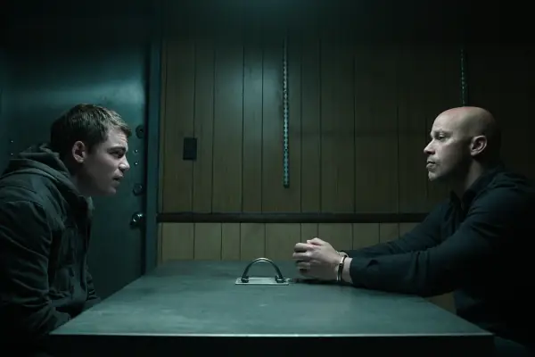 Gabriel Basso as Peter Sutherland and Berto Colon as Solomon in The Night Agent