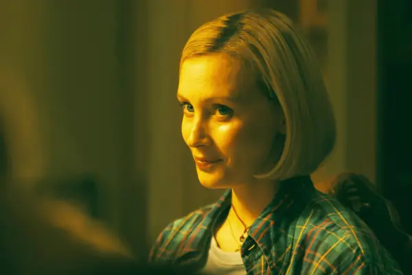 Close up of Sarah Gadon as Laura Redman, wearing a plaid shirt