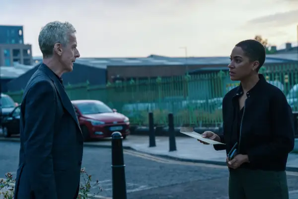 Peter Capaldi and Cush Jumbo staring at each other