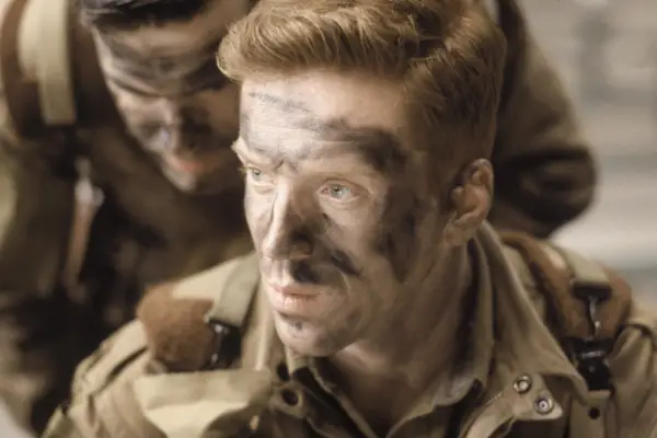 Damian Lewis in Band of Brothers wearing military uniform and face paint