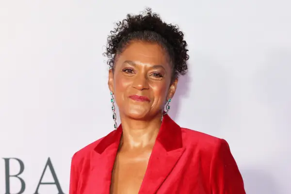 Cathy Tyson wearing a red blazer
