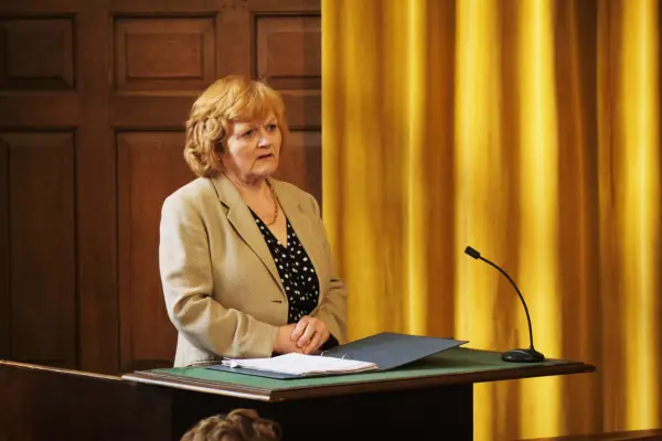 Lesley Nicol as Pam Stubbs, standing up to speak in court