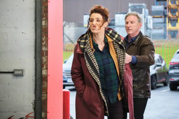 Bronagh Waugh as Detective Inspector Carol Farman, shouting at someone in a garage while being held back by Ridley