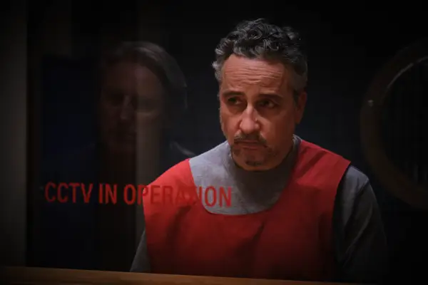 Julie Graham plays Annie Marling, at a bar, smiling, drink in hand