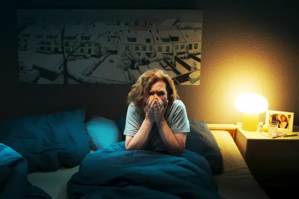 Close-up of Hannah looking directly at the camera in the high security home