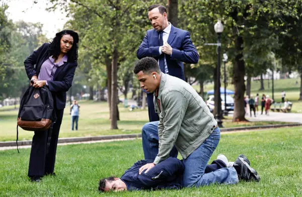 Sonequa Martin-Green as Lena Silver, Donnie Wahlberg as Danny Reagan, Jeramie Burgos as Caleb Bruce, and Marcus Scribner as Jonah Silver in Blue Bloods.