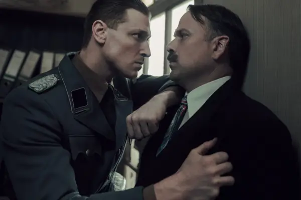 Nicholas Burns, as Victor Kugler (right) in A Small Light