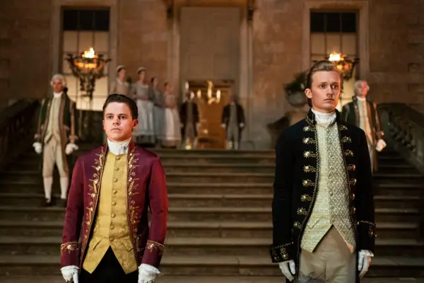 Brimsley and Reynolds stood apart at the bottom of the steps in their unform