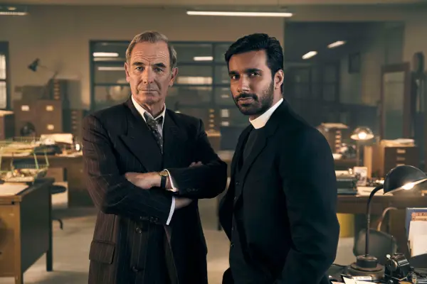 Robson Green as DI Geordie Keating and Rishi Nair as Reverend Alphy Kotteram in Grantchester in a police office