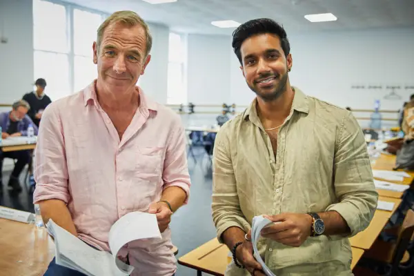 Grantchester season 9 - Robson Green and Rishi Nair standing with scripts