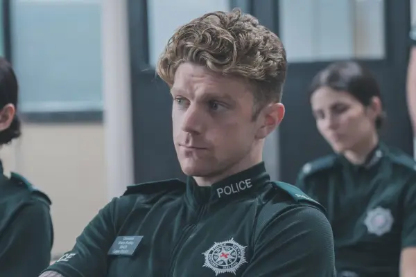 Frank Blake in Blue Lights sat in uniform