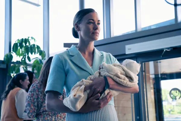 Yvonne Strahovski as Serena, holding a baby