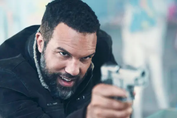 O-T Fagbenle plays Luke, pointing a gun