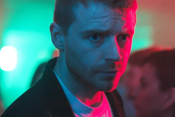 Gary Oldman as Jackson Lamb in Slow Horses sat in a diner on the phone