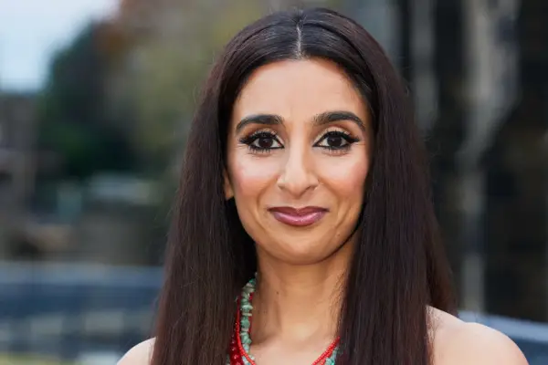 Slose up of Chandeep Uppal as Kam Lal, smiling