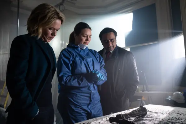 The cast of Unforgotten season 5 looking at a bone