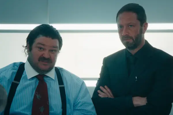 Matty Matheson as Neil Fak and Jeremy Allen White as Richie in The Bear stood in a kitchen looking tense