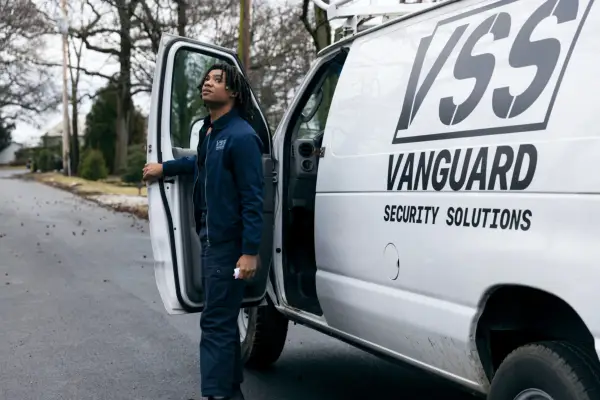 Dakota climbing out of his white work van