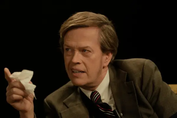 Dylan Baker plays Biff Simpson in Hunters