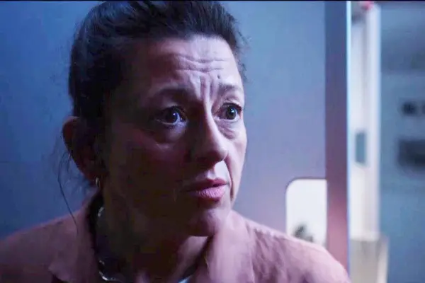 Close up of Jo Hartley as Beth Thomas on an airplane