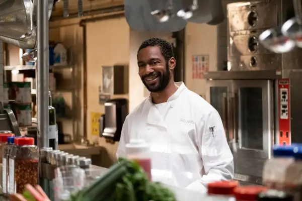 Erik standing in the kitchen with his kitchen whites on