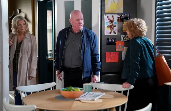 Kathy and Julie talking to Phil in EastEnders