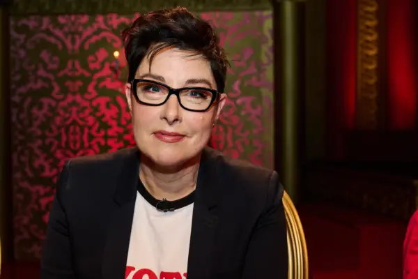Sue Perkins in the Taskmaster studio, looking into the camera