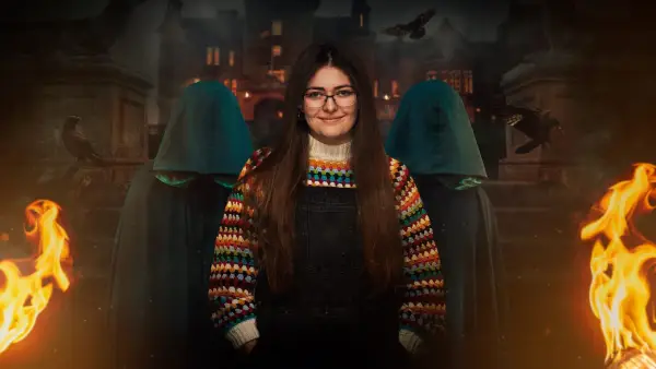 Meg for The Traitors season 2. Meg is wearing a multi-coloured jumper and glasses.