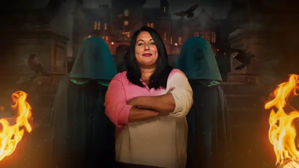 Ash for The Traitors season 2. She is wearing a multi-coloured jumper with her arms folded