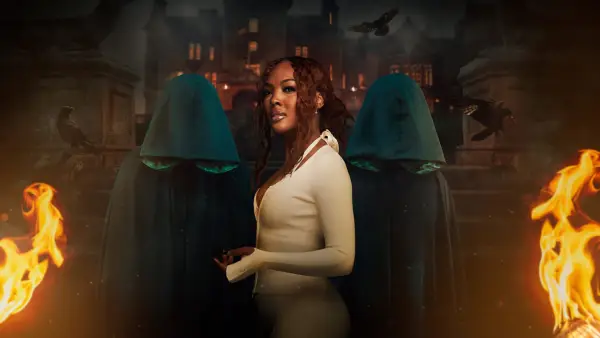 Kyra for The Traitors season 2. Kyra has her back turned and is wearing a white cardigan