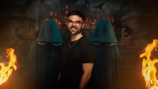Ross for The Traitors season 2. Ross is wearing a black t-shirt and is smiling