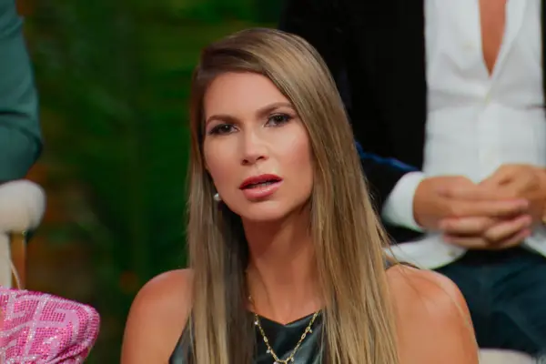 Maya Vander looking confused at something ahead of her.