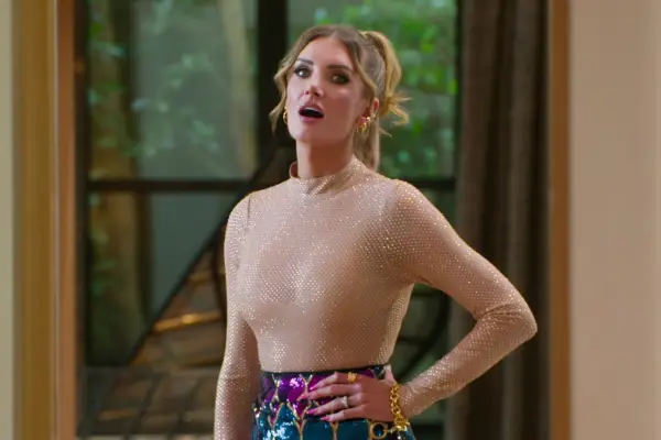 Nicole Young with her hand on her hip in the middle of a conversation.