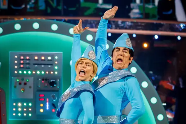 Ross King and Jowita Przystal stand to attention each with an arm outstretched above them whilst dancing the Paso Doble to the Thunderbirds Theme from Thunderbirds.