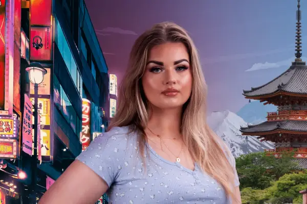 Woman with blonde hair smiles at camera with scene of Japan behind her.